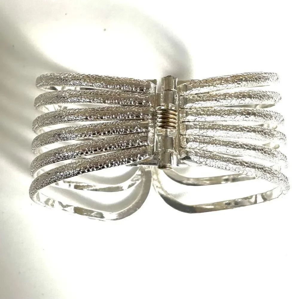 Silver tone textured hinged wide bracelet